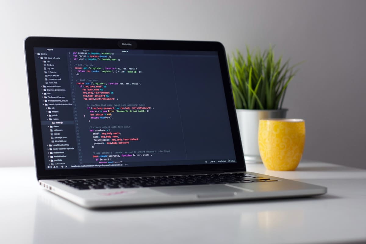 laptop coding on screen
