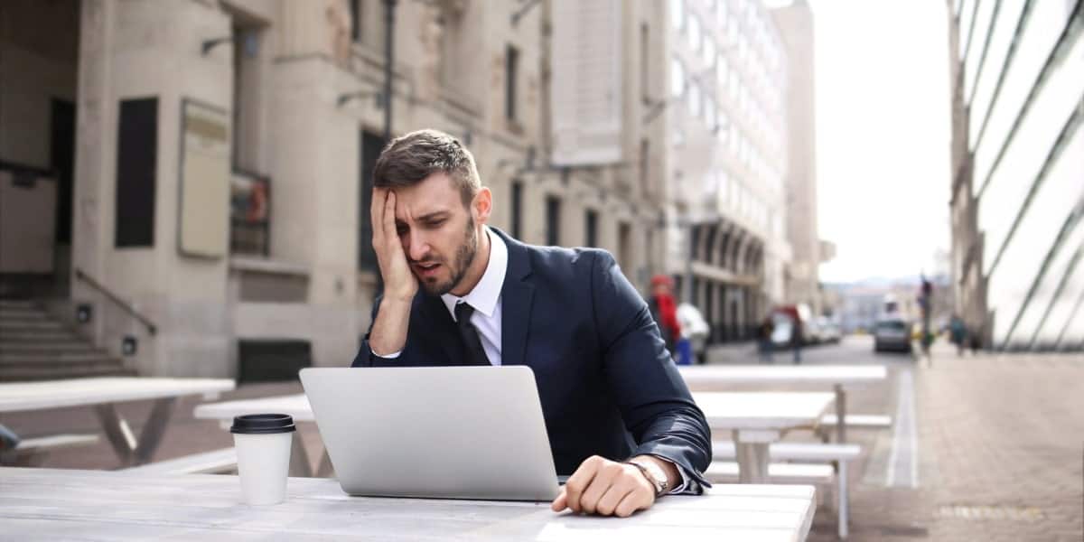 man looking frustrated at blocked websites