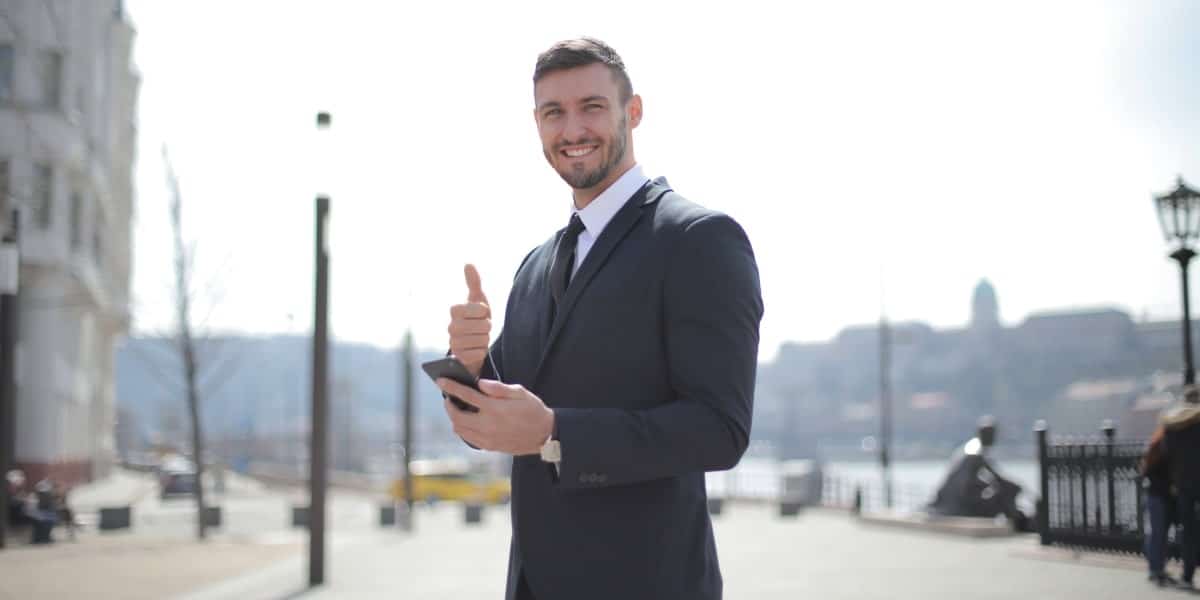 man looking satisfied and giving thumbs up at unblocked websites